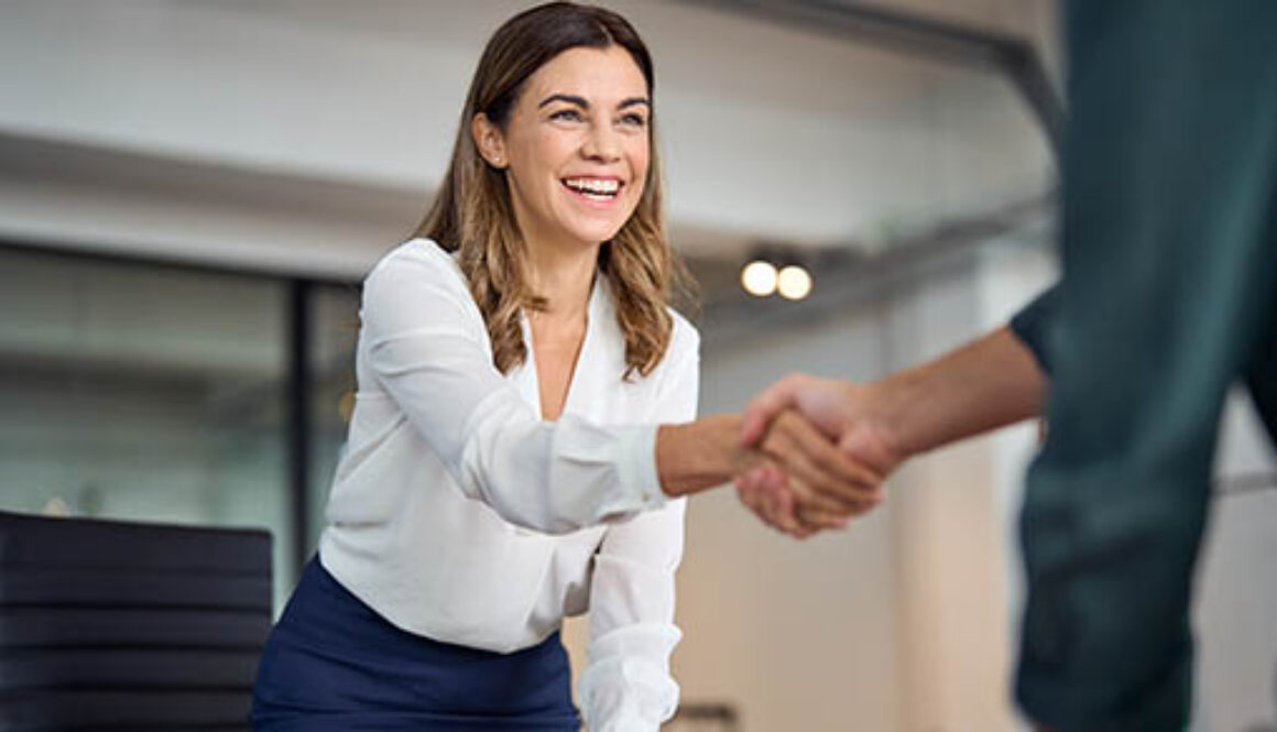 Happy,Mid,Aged,Business,Woman,Manager,Handshaking,Greeting,Client,In