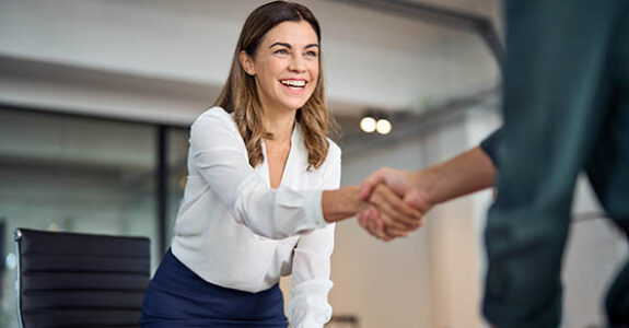 Happy,Mid,Aged,Business,Woman,Manager,Handshaking,Greeting,Client,In